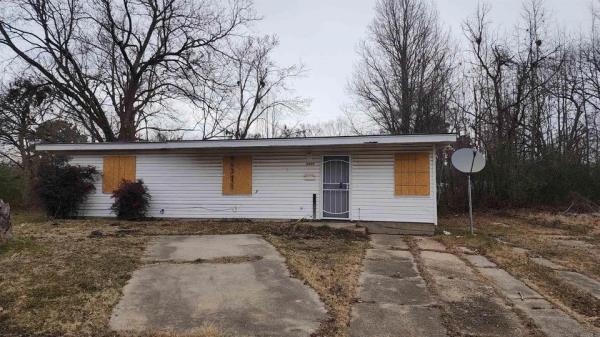 A fixer-upper house in Pine Bluff, Arkansas listed for $10,000 with an offer pending. This home is part of the tiny town where homes sell for as low as $400.